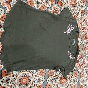 Dark green short sleeve shirt with flower design